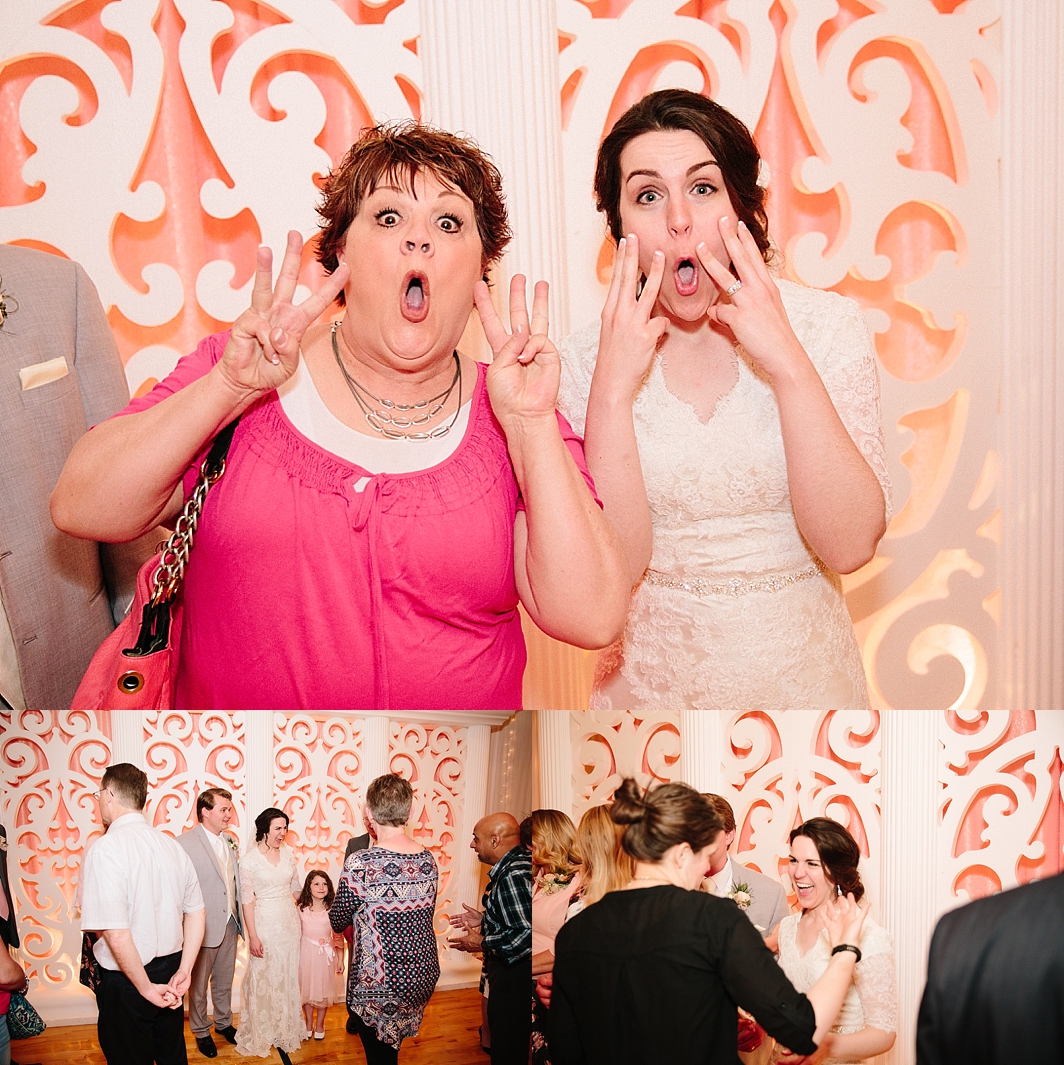 bride making funny faces with wedding guests 