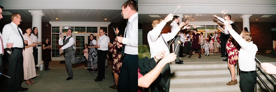 guests lighting up the exit with sparklers for couple's sparkler exit