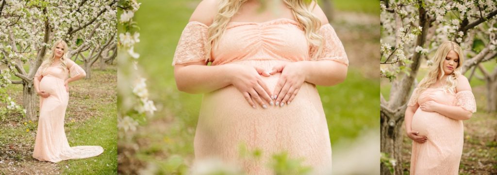 woman placing hands on pregnant belly in shape of heart