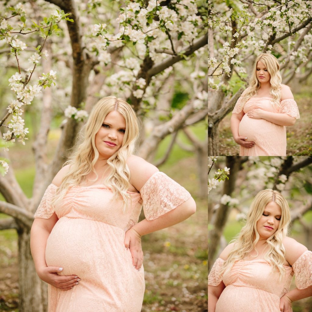blonde woman wearing off the shoulder pink gown during apple blossoms maternity session