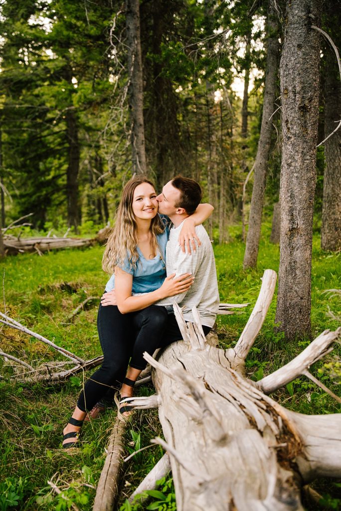 Island Park Couples Photography sitting on log