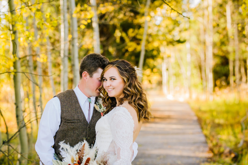 bride and groom hugging during romantic golden hour bridals