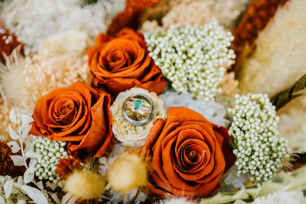 bridal bouquet with rust roses and baby's breath at eagle ridge ranch wedding