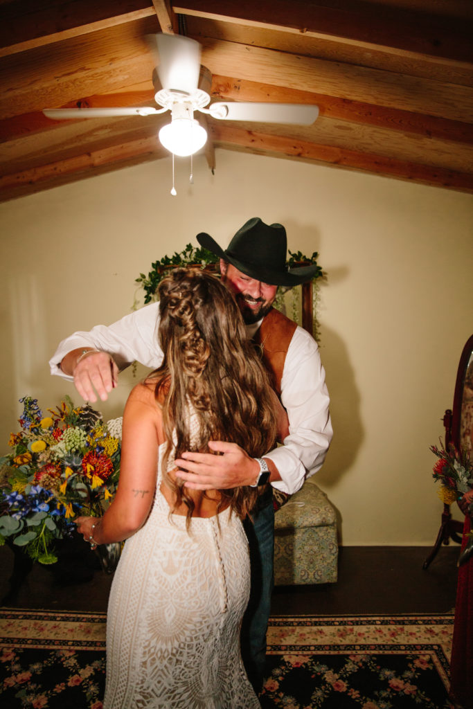 daughter hugging father on wedding day during first look