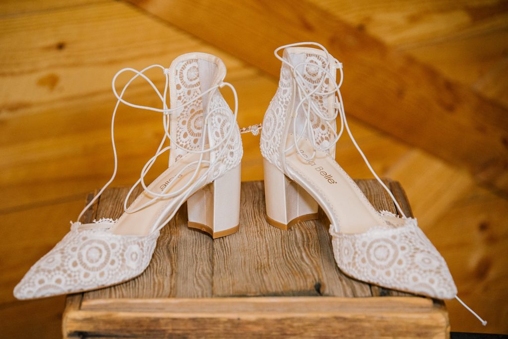Shoes and ring details in blackfoot barn wedding