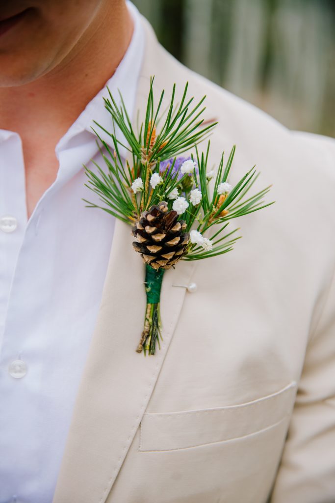 grooms boutonniere on a cream suit coats