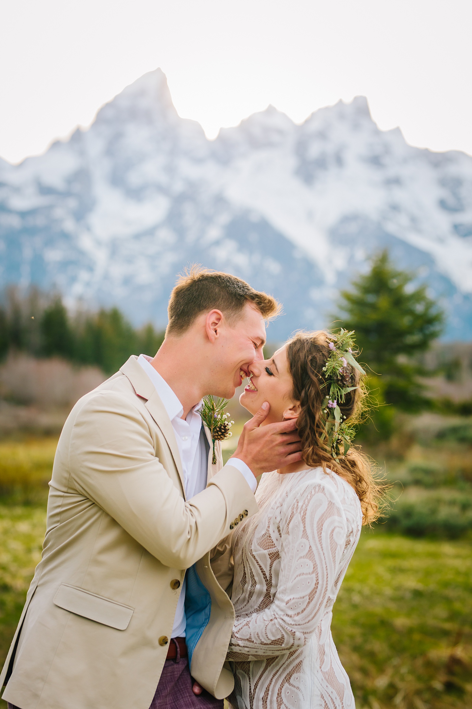 bride and groom leaning in to kiss each other photographed by Grand Teton wedding photographers 