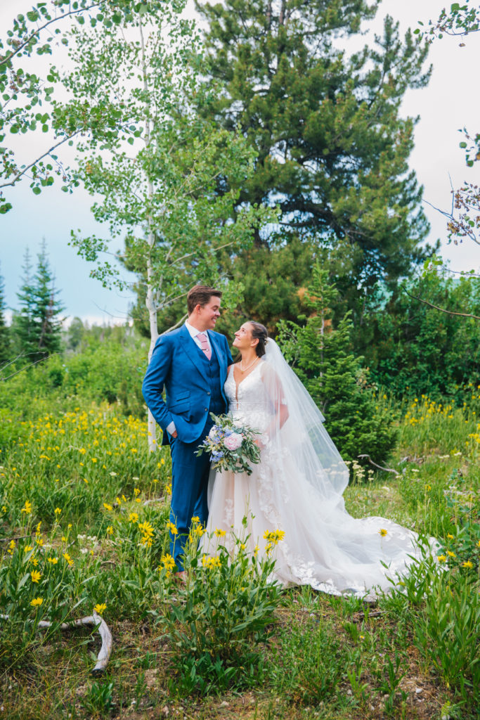 bride and groom looking at one another during spring Jackson Hole bridals