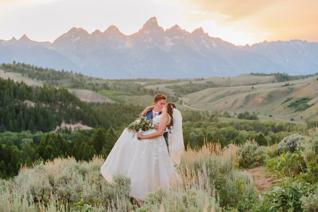 bride and groom kissing in jackson hole