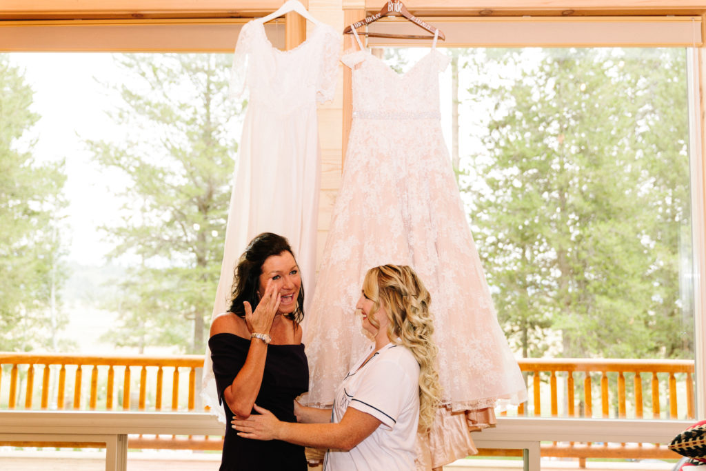 bride with her mother on wedding day at island park cabin wedding