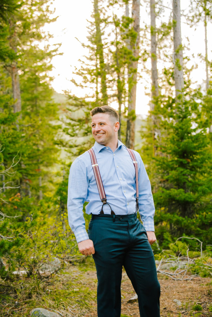 groom smiling during portraits
