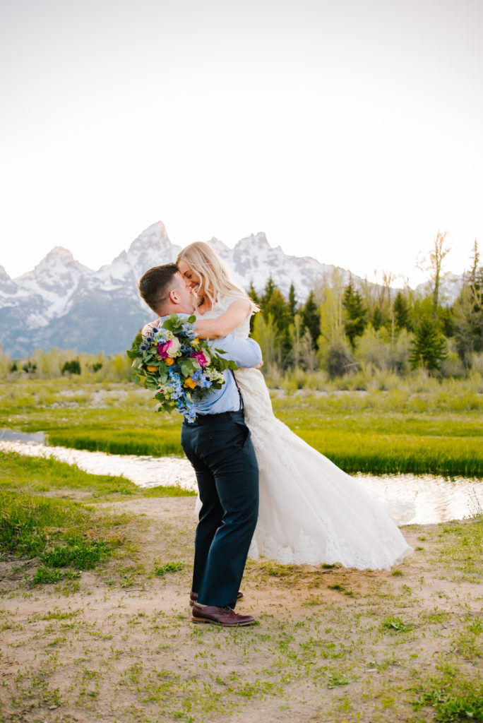 bride and groom kissing in grand teton national park