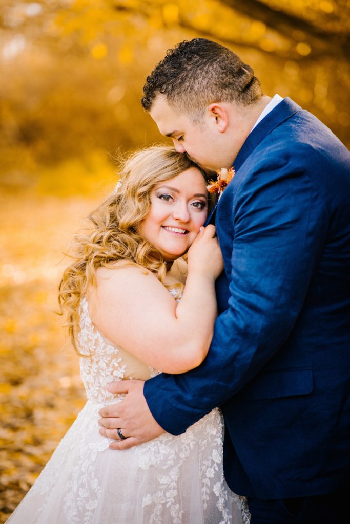 Jackson Hole wedding photographer captures bride and groom embracing one another