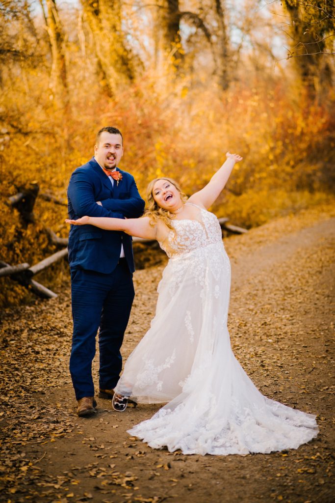 Jackson Hole wedding photographer captures bride and groom having fun outdoors during portraits