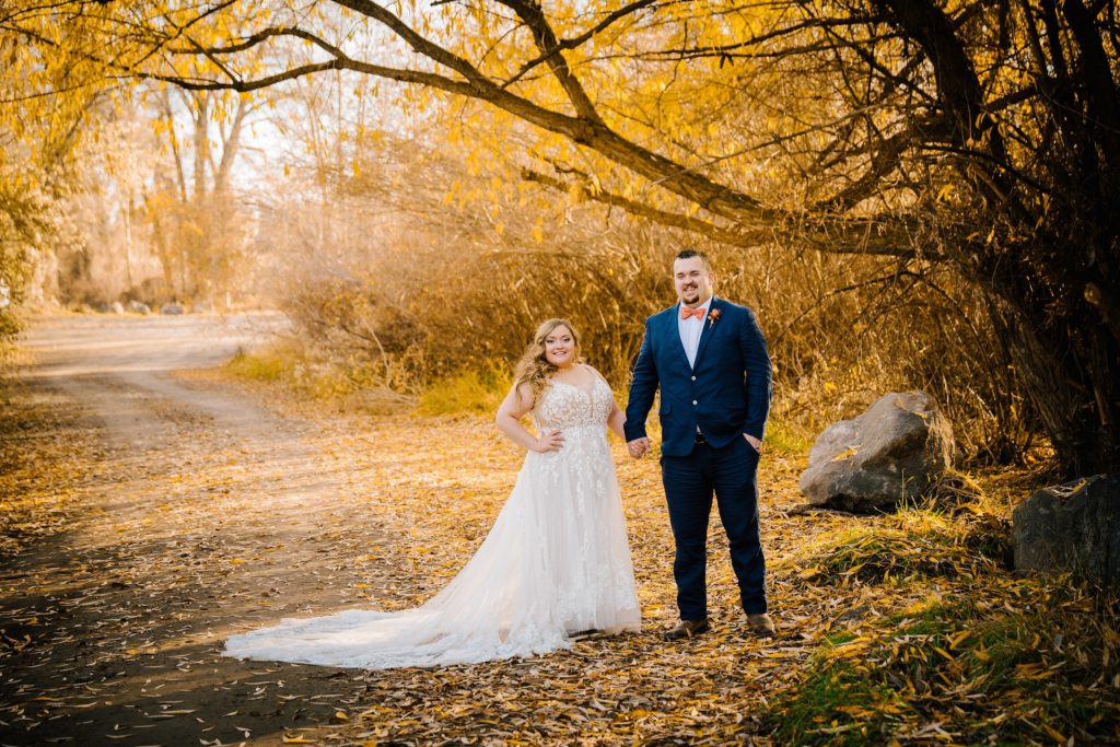 Jackson Hole wedding photographer captures bride and groom holding hands