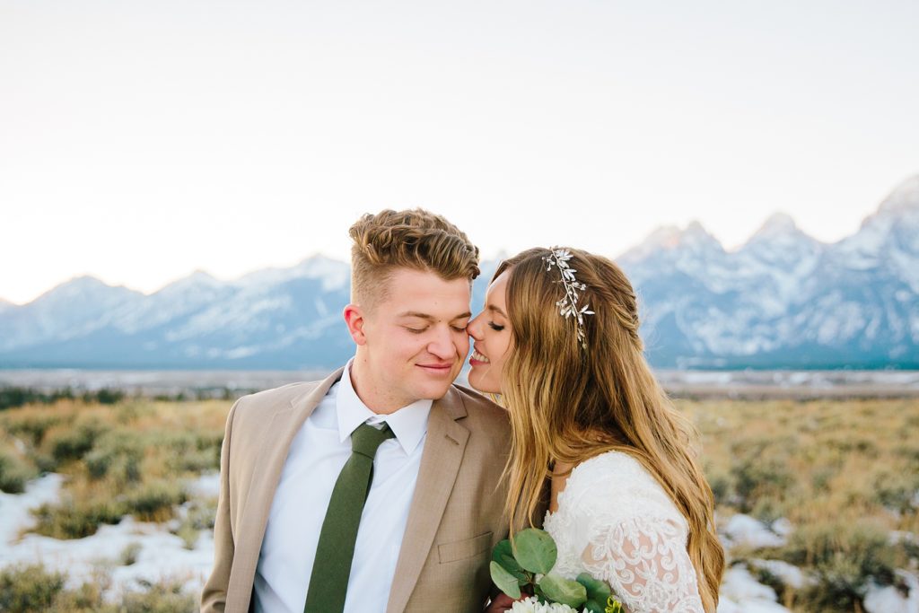Jackson Hole wedding photographer captures bride kissing groom's cheek