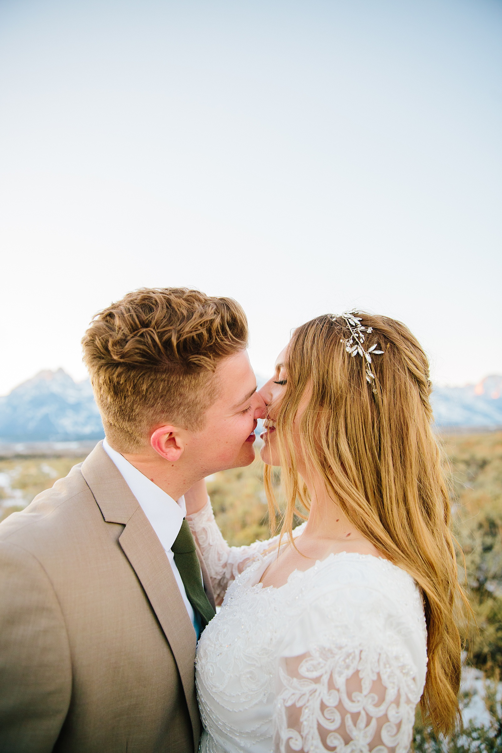 bride and groom smiling as they are about to kiss captured by best Pocatello wedding photographer 
