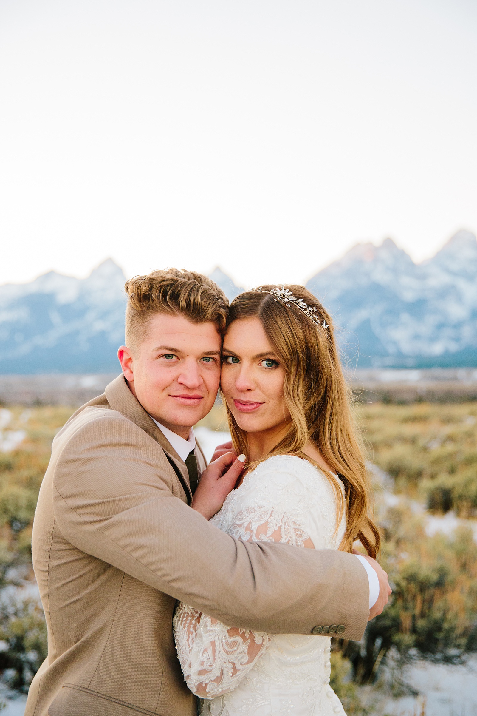 Pocatello wedding photographer captured outdoor bridals with couple holding each other in Pocatello