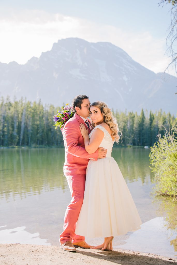 Jackson Hole wedding photographer captures Bride and groom in the candid moment at Leigh Lake Elopement