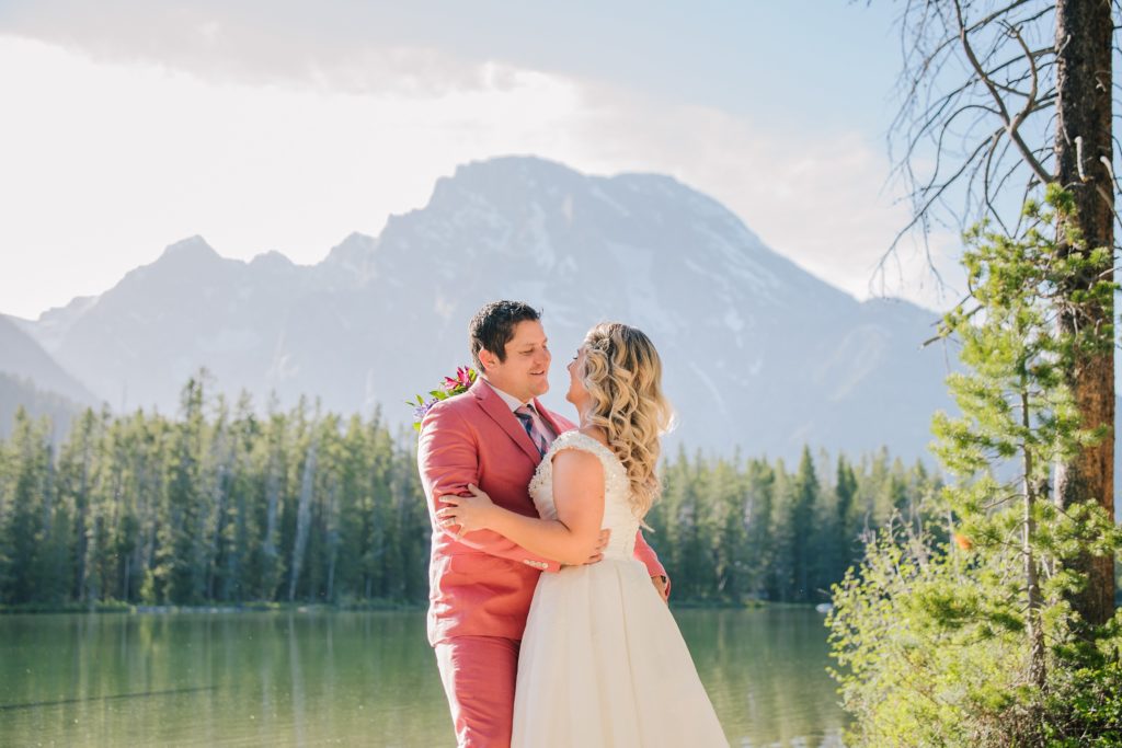 Jackson Hole wedding photographer captures bride and groom hugging