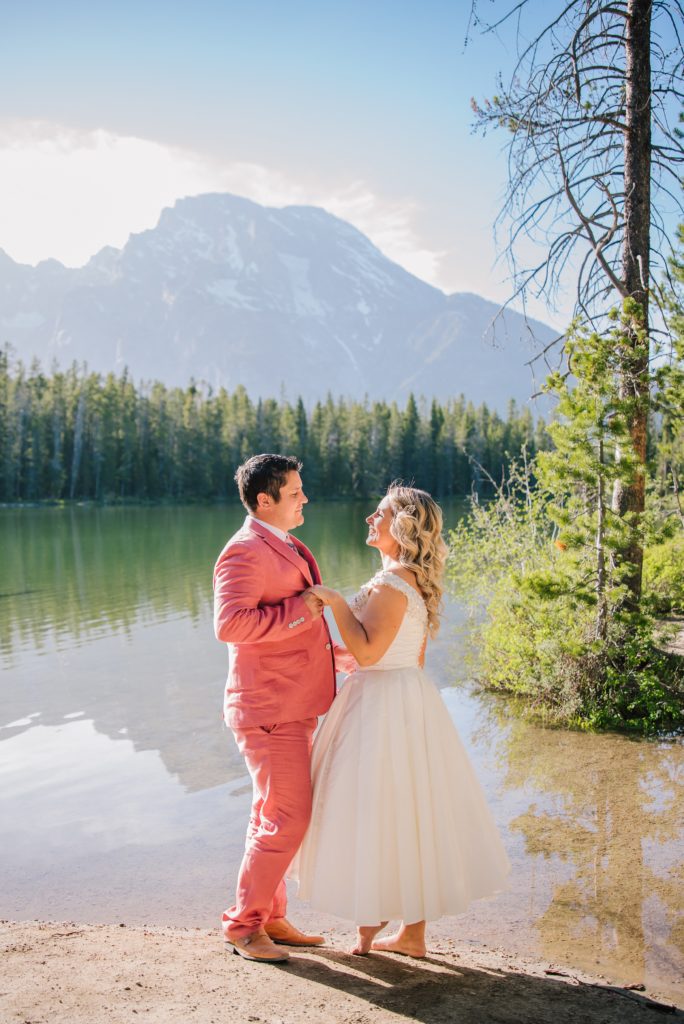 Jackson Hole wedding photographer captures bride and groom dancing at Leigh Lake Elopement