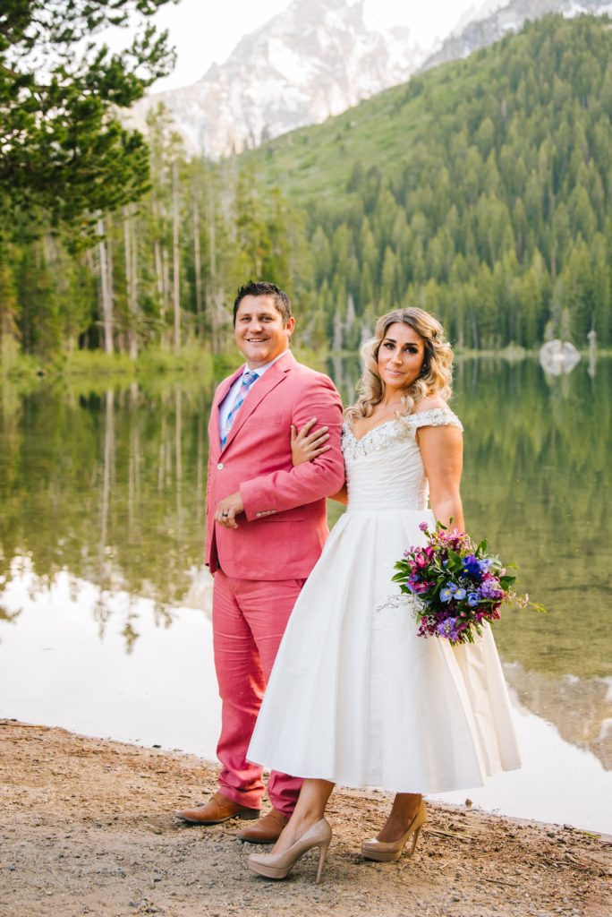 Jackson Hole wedding photographer captures groom in pink suit at Leigh Lake Elopement