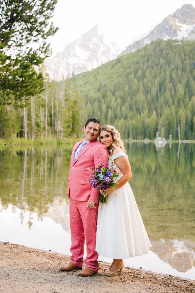 Jackson Hole wedding photographer captures couple standing together during Leigh Lake Elopement