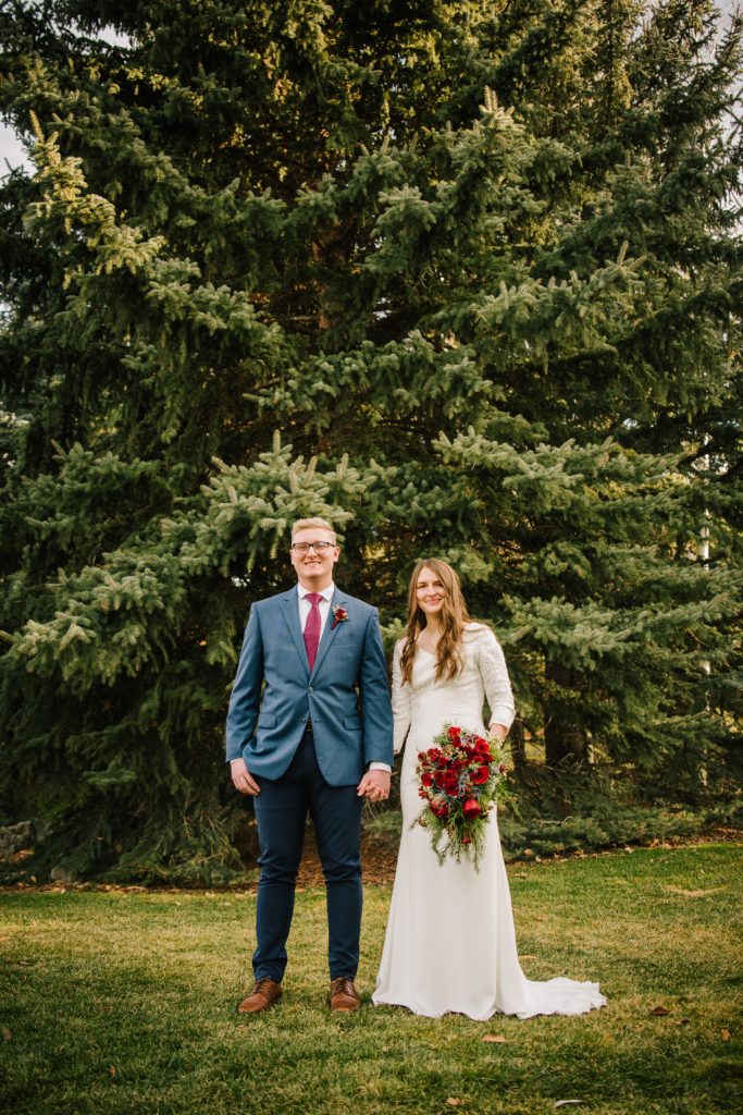 Jackson Hole wedding photographer captures fall wedding in the woods with floral bouquet