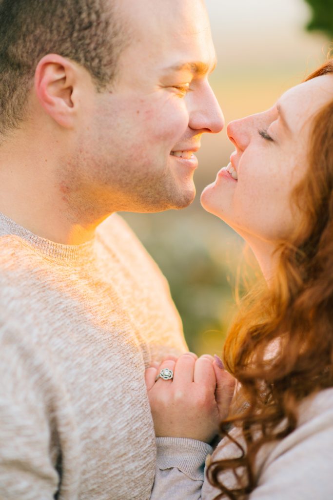 Jackson Hole wedding photographer captures couple kissing during sunset engagements