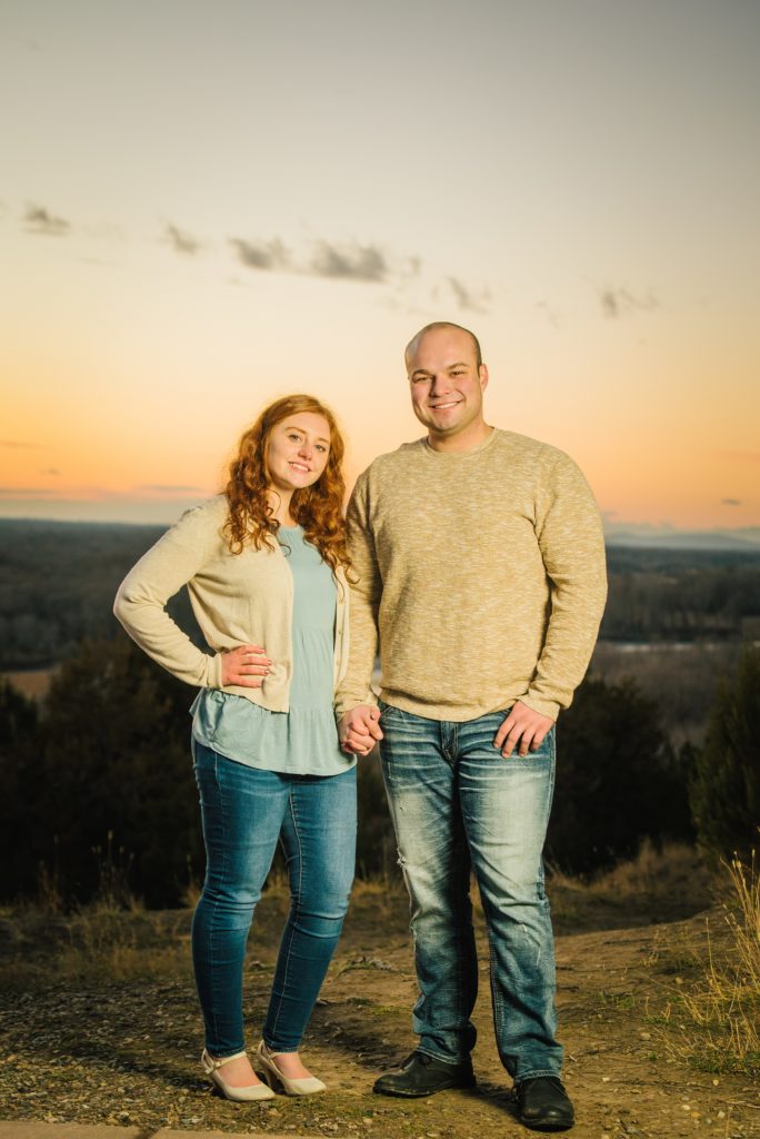 Jackson Hole wedding photographer. captures couple standing together during sunset portraits