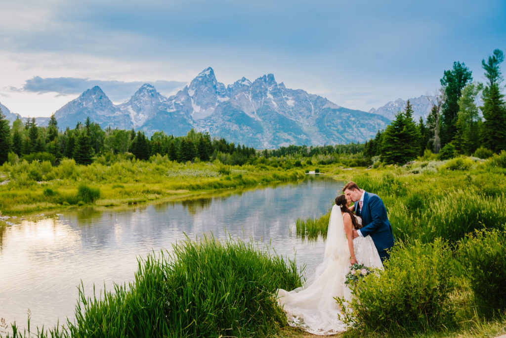 Jackson Hole wedding photographer captures bride and groom kissing in grand teton national park