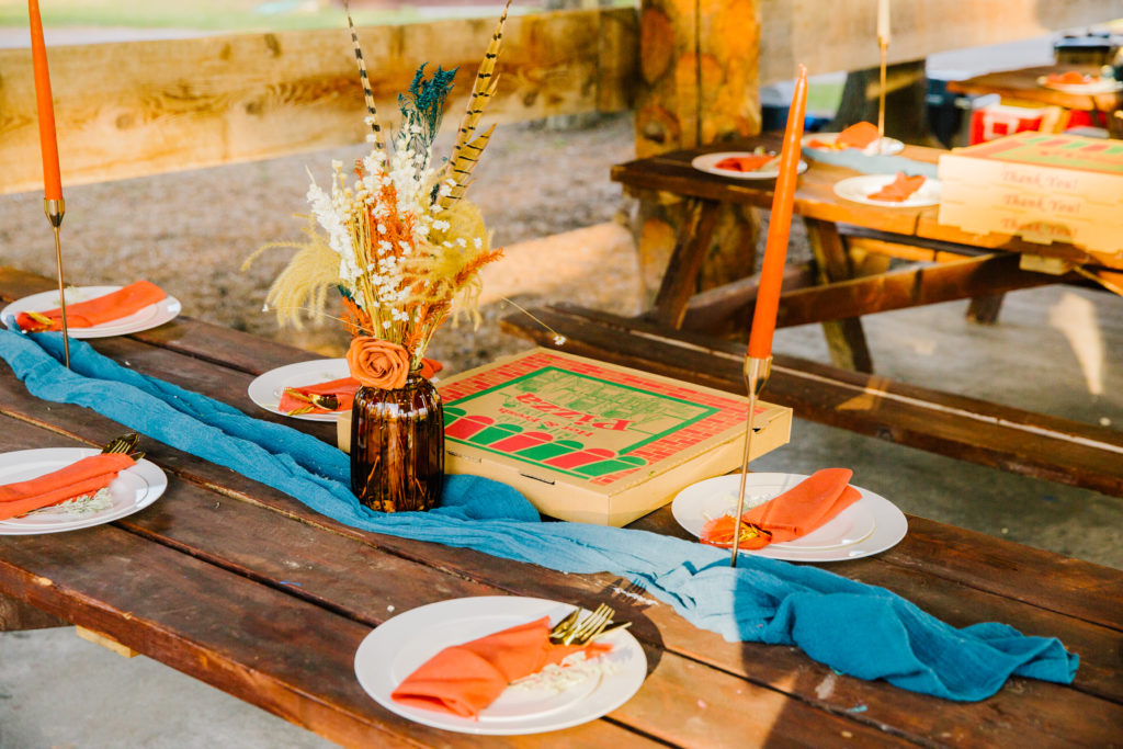 Jackson Hole wedding photographer captures table setting boho island park wedding with pizza