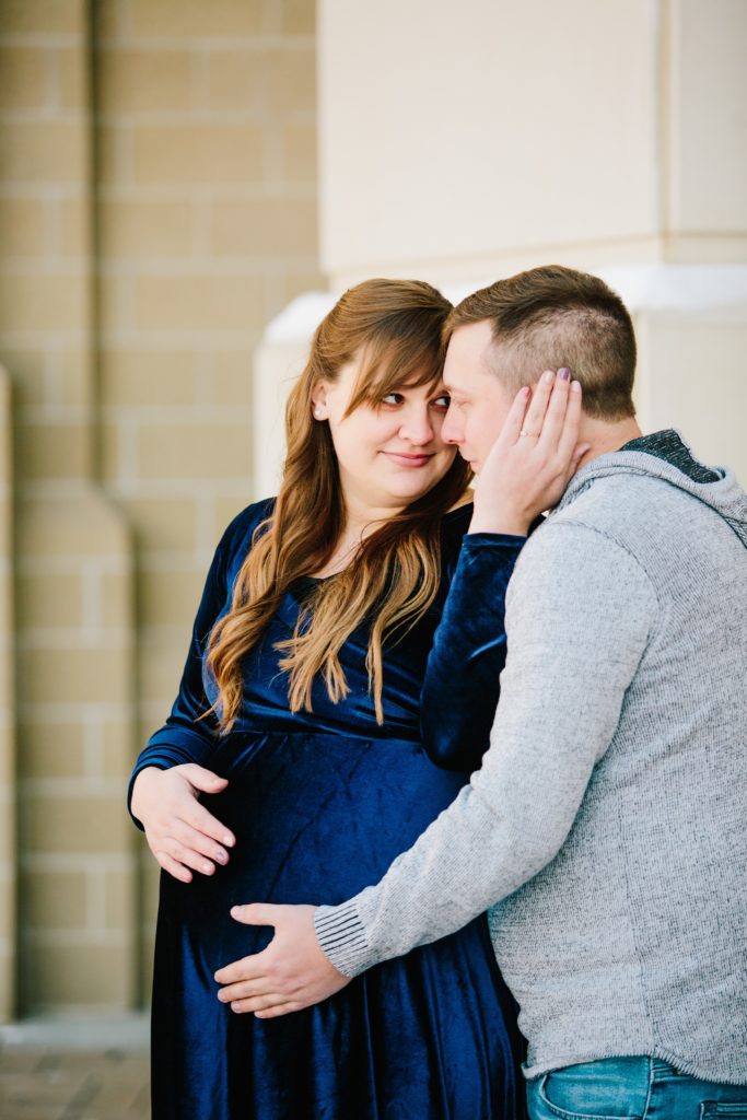 Jackson Hole wedding photographer captures husband holding pregnant wife's belly