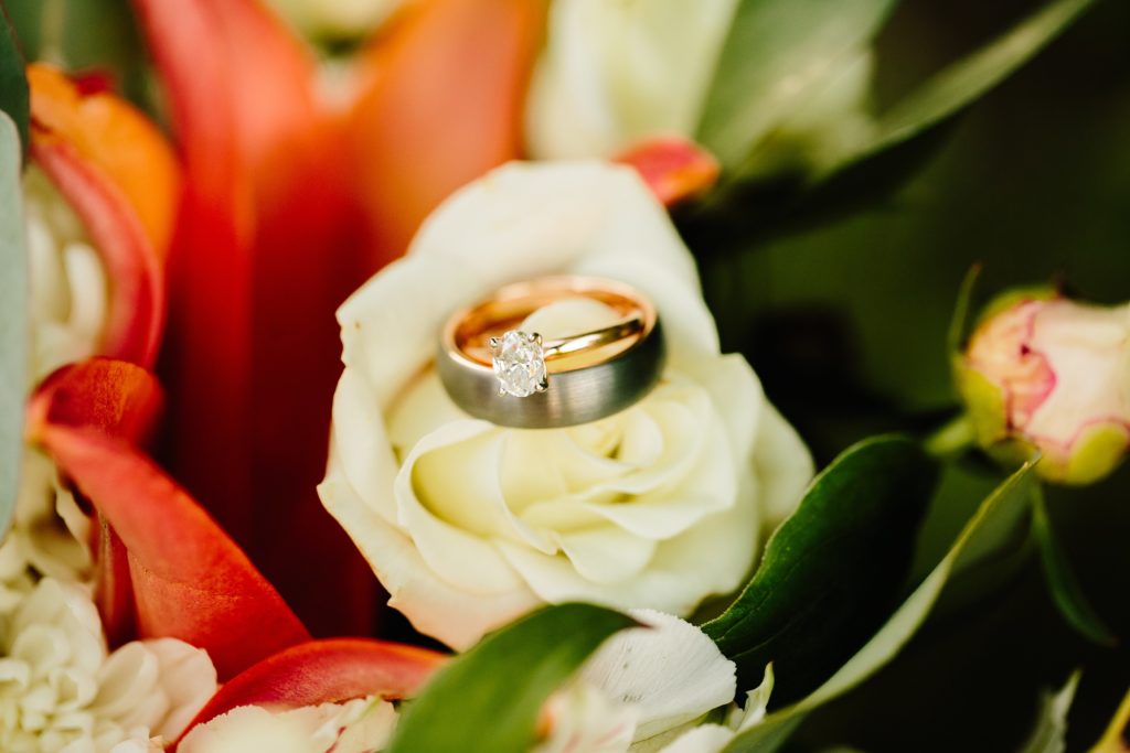Jackson Hole wedding photographer captures Ring shot of ring in flowers