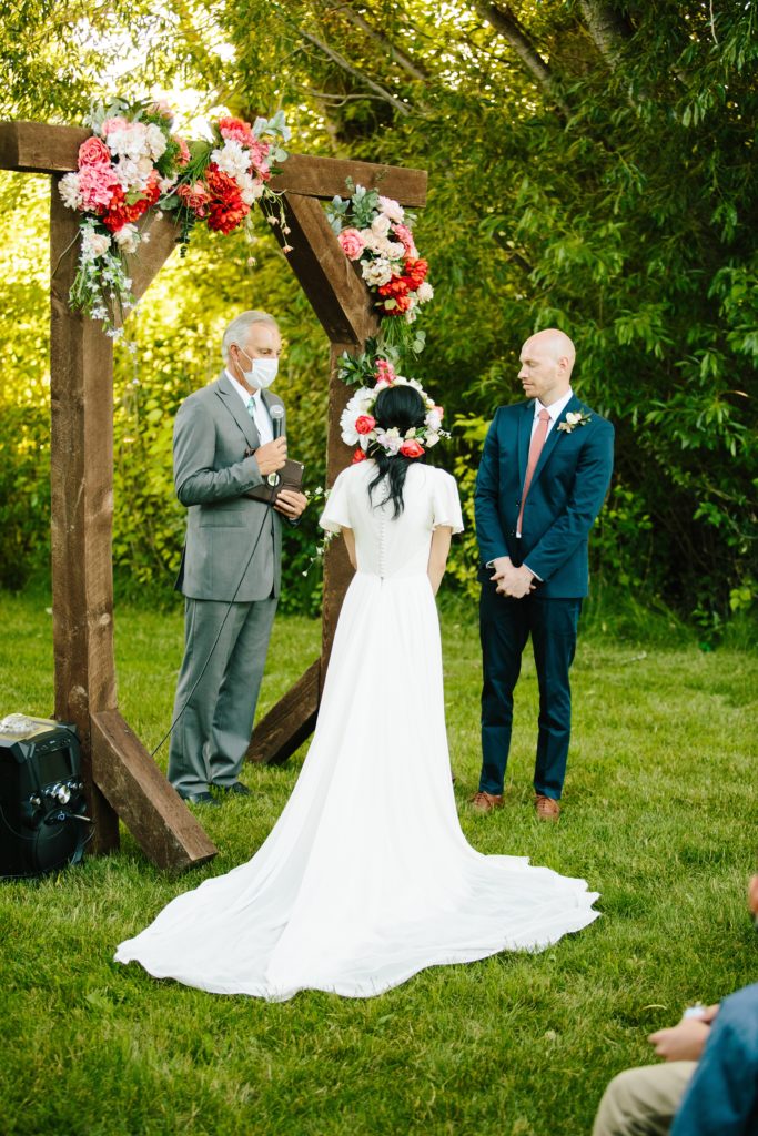 Jackson Hole wedding photographer captures Bride reading her vows to groom at pocatello wedding