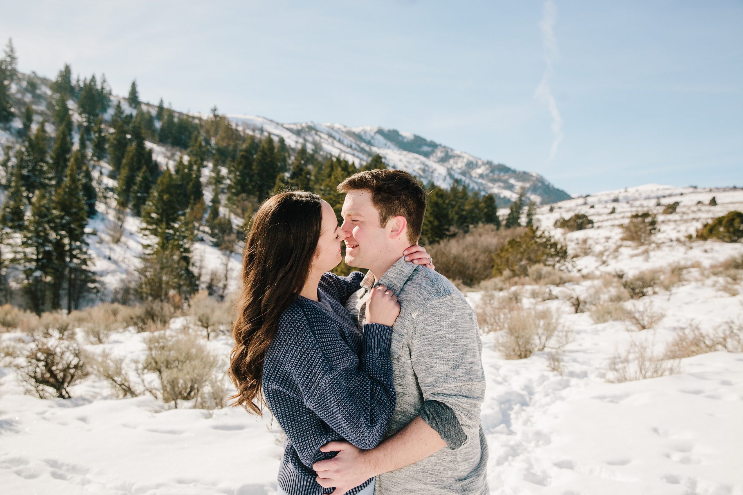 Jackson Hole wedding photographers capture Kissing couple during idaho engagements