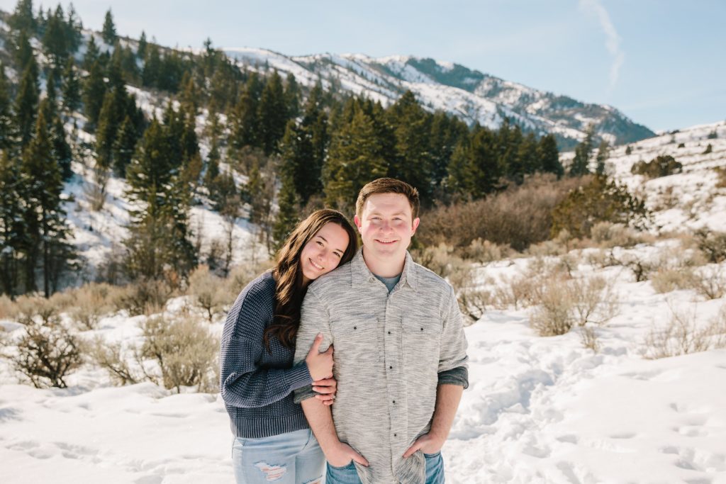 Jackson Hole wedding photographer captures woman hugging man during pocatello engagement session