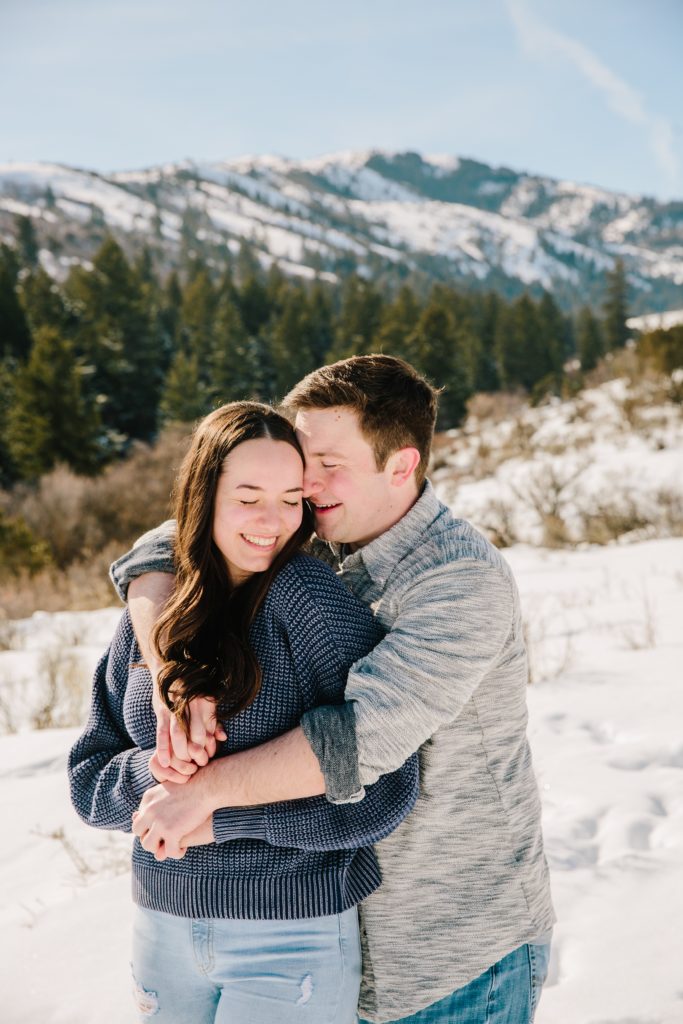 Jackson Hole wedding photographer captures man wrapping arms around woman