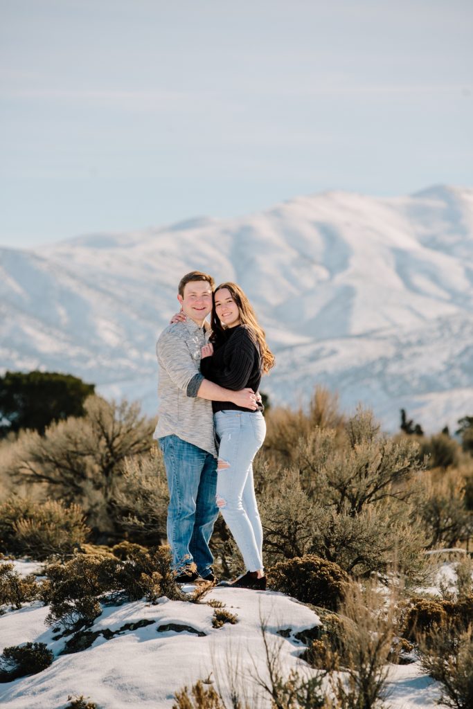 Jackson Hole wedding photographers capture engaged couple hugging