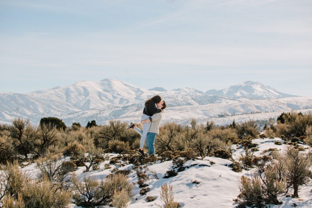 Jackson Hole wedding photographer captures newly engaged couple kissing during idaho engagements