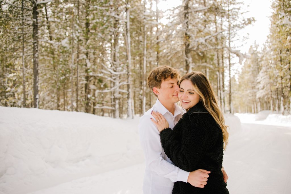 Jackson Hole wedding photographer captures couple embracing during outdoor engagements
