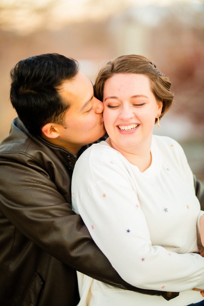 Jackson Hole wedding photographer captures man kissing woman on cheek pocatello wedding photographer