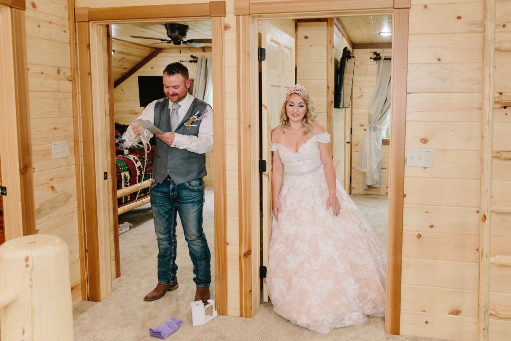 Jackson Hole wedding photographer captures Bride and groom exchanging gifts before wedding