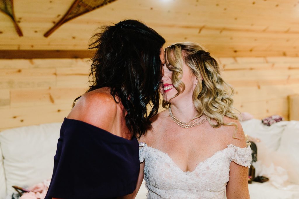 Jackson Hole wedding photographer captures mother and daughter butterfly kisses