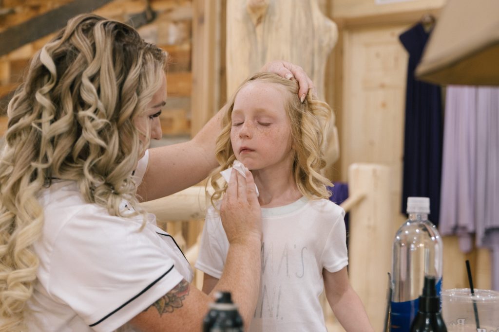 Jackson Hole wedding photographer captures daughter getting makeup done