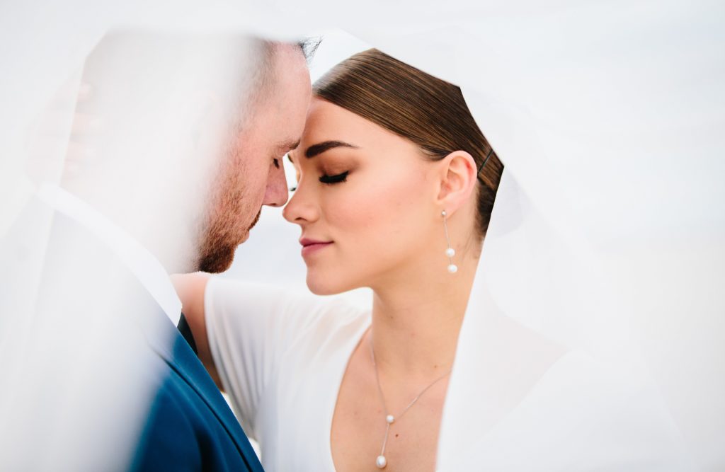 Jackson Hole wedding photographer captures Under the veil bride and groom romantic