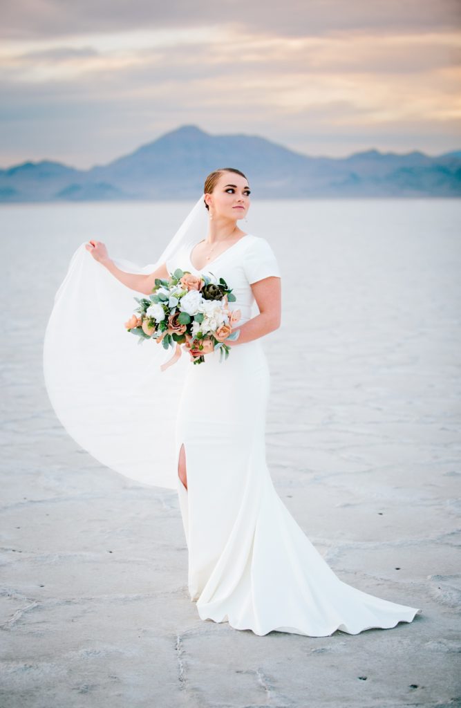 Jackson Hole wedding photographer captures Bride with veil at salt flats in utah
