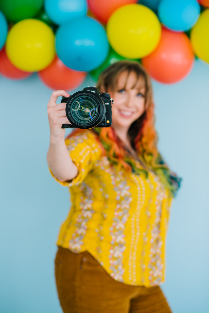Jackson Hole wedding photographer captures woman holding camera 