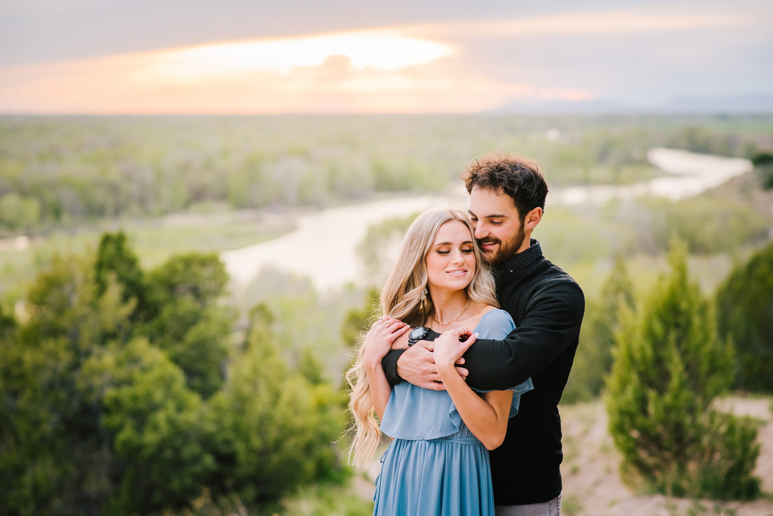 Jackson Hole wedding photographer captures man and woman embracing during jackson hole engagements