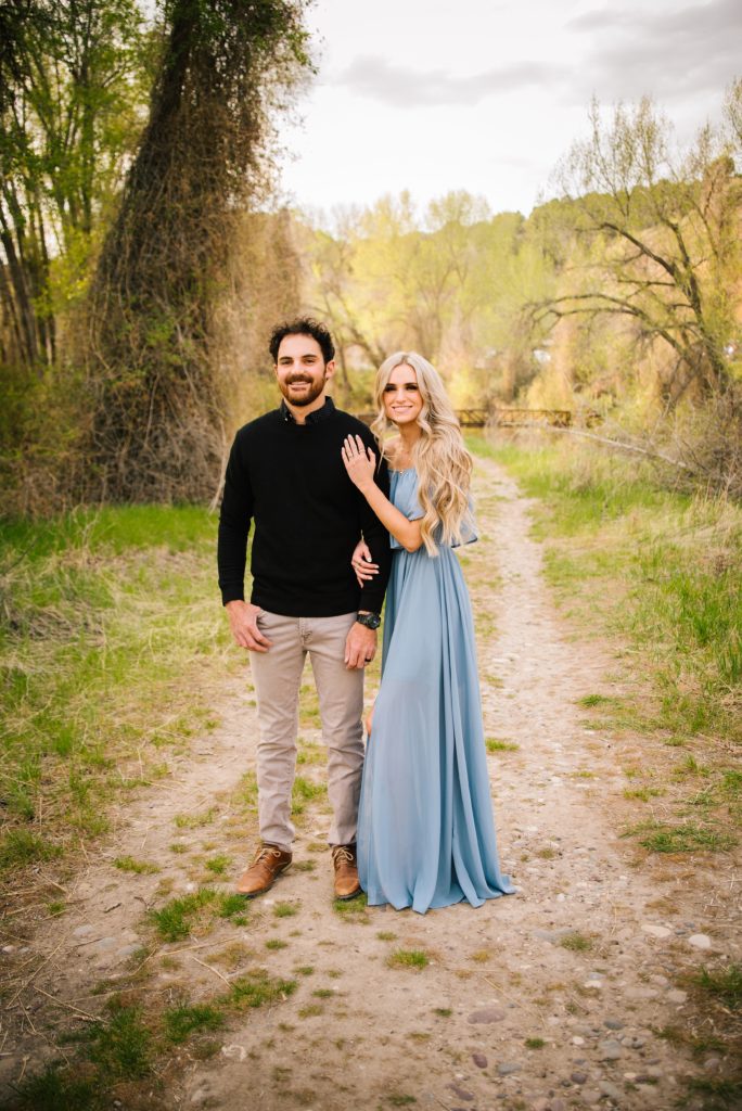 Jackson Hole wedding photographer captures Couple posed in formal blue dress kelly canyon photography